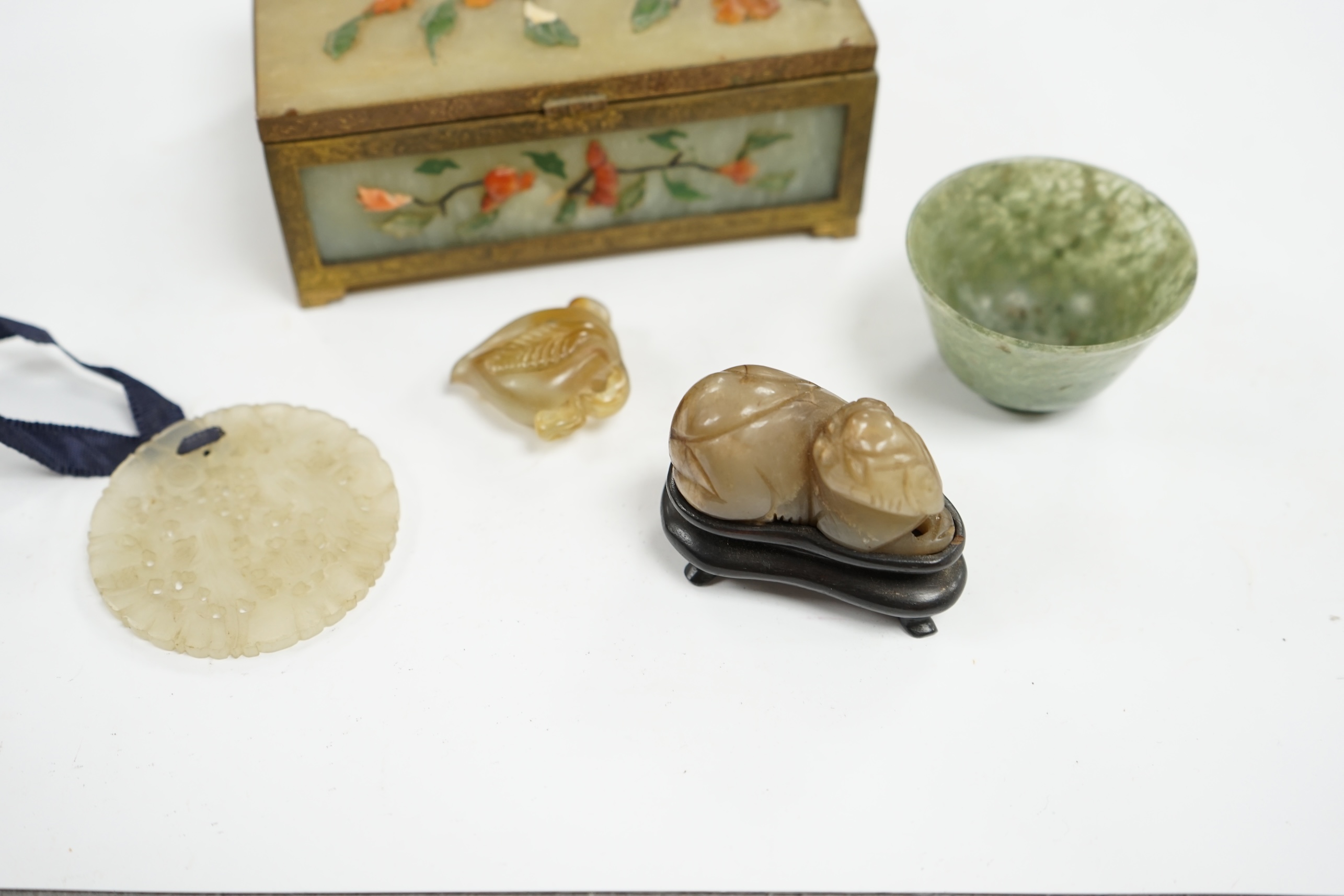 A group of Chinese jade and hardstone carvings to include a cigarette box & cover and a 14K mounted Yamanaka & Co pouch, largest 13cm wide. Condition - mostly fair